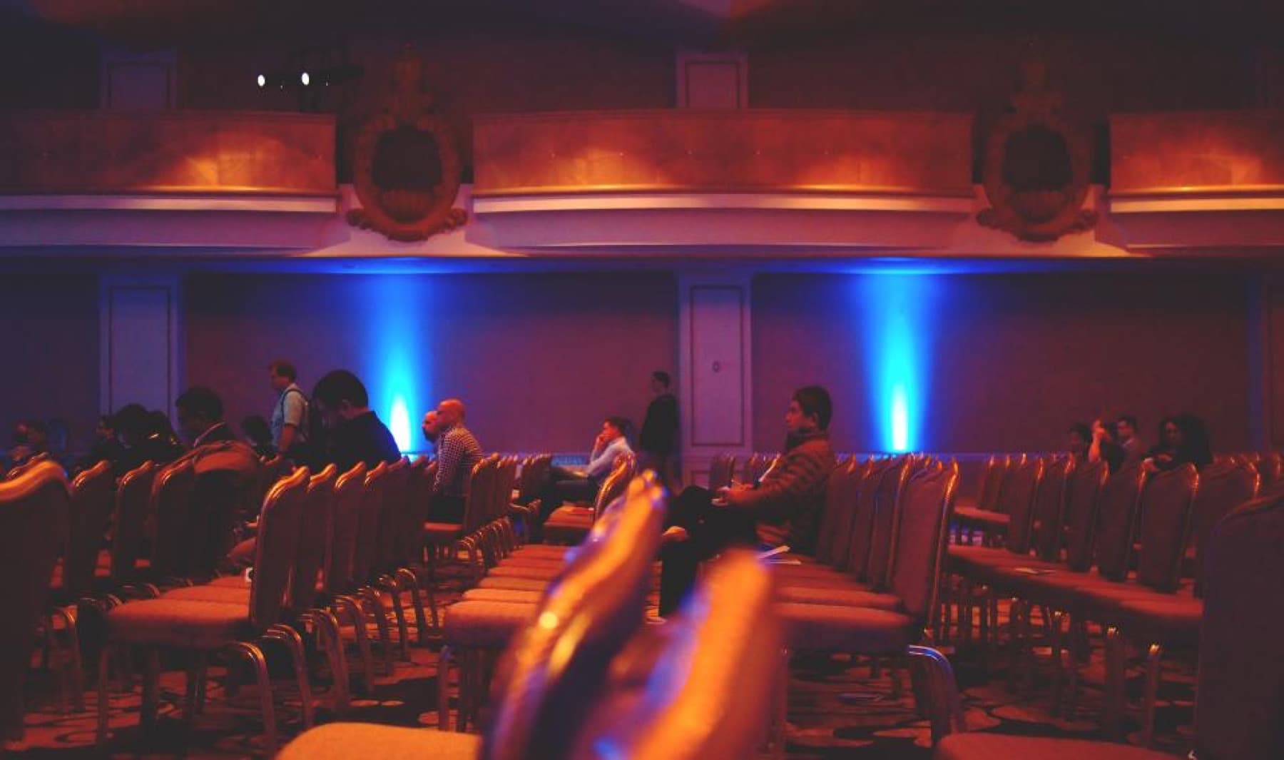 An auditorium lit for a conference