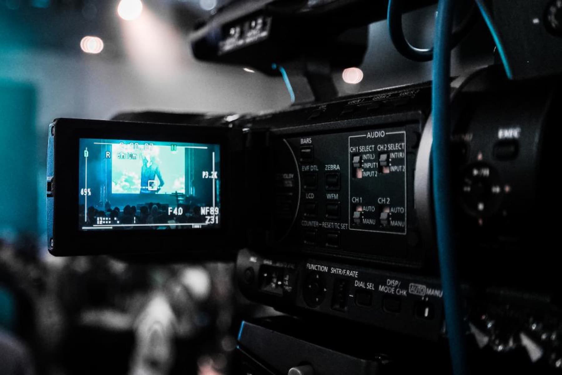 A cinema camera with its monitor lit